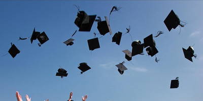 Graduates throwing their caps in the air, ready to kick-start their careers